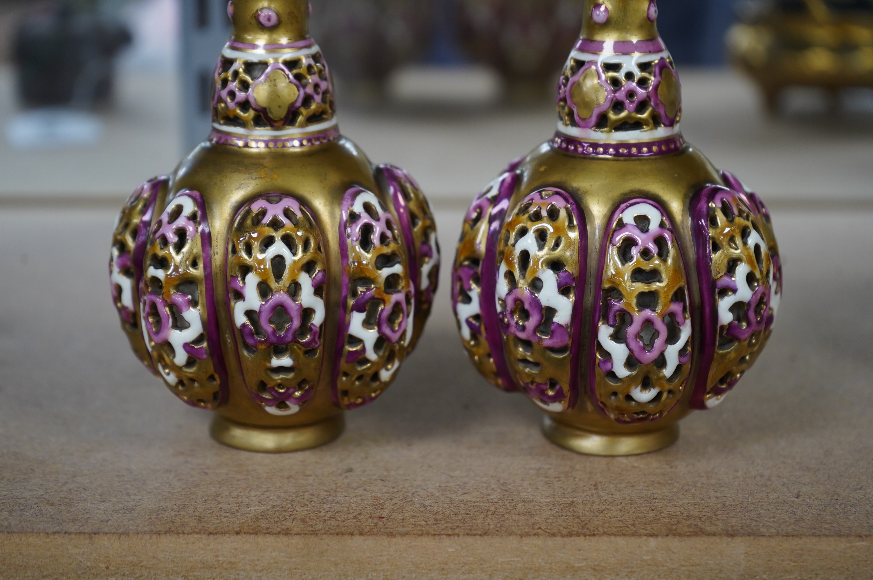 A pair of small Hungarian Zsolnay reticulated vases, 15cm high. Condition - good